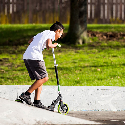 Boy riding a scooter