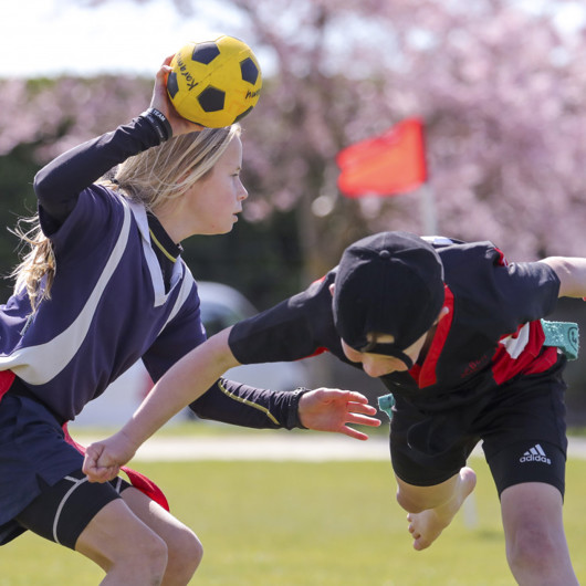 Playing Kī o rahi, a traditional Māori sport