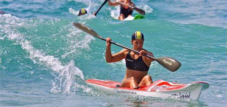 Lisa Carrington canoeing in the ocean