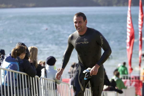 Nathan Twaddle in a wetsuit near the beach