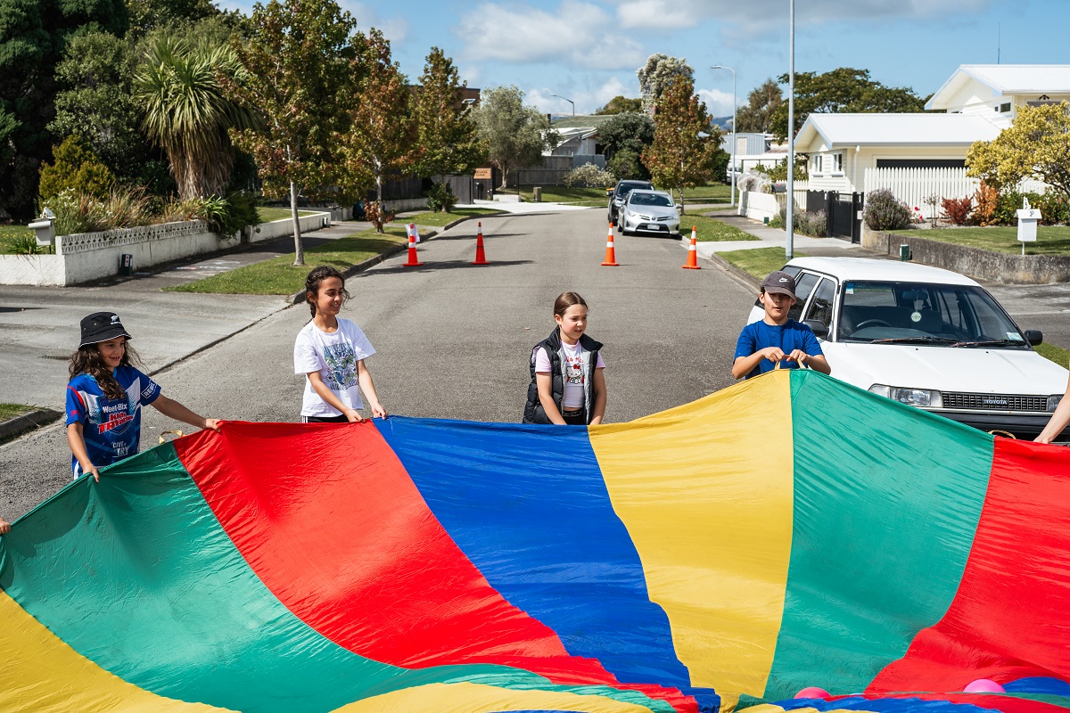 Play streets event with a fabric parachute