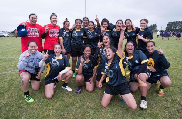 Group of young women celebrating on the field