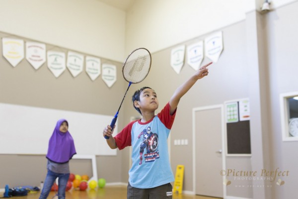young boy playing Badminton