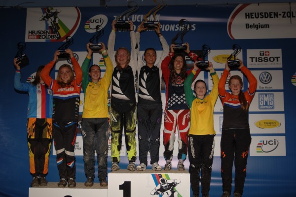 Young people at the BMX World Champs holding up their trophies