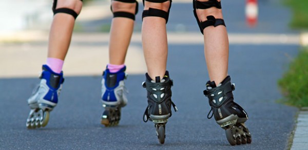 Two people rollerblading