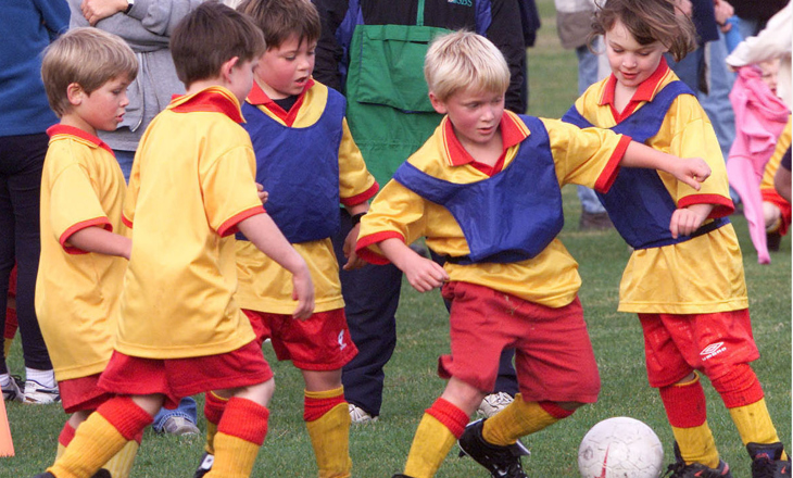 Group of kids playing soccer