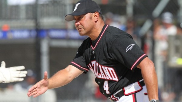 Softball player about to shake hands with another player off camera