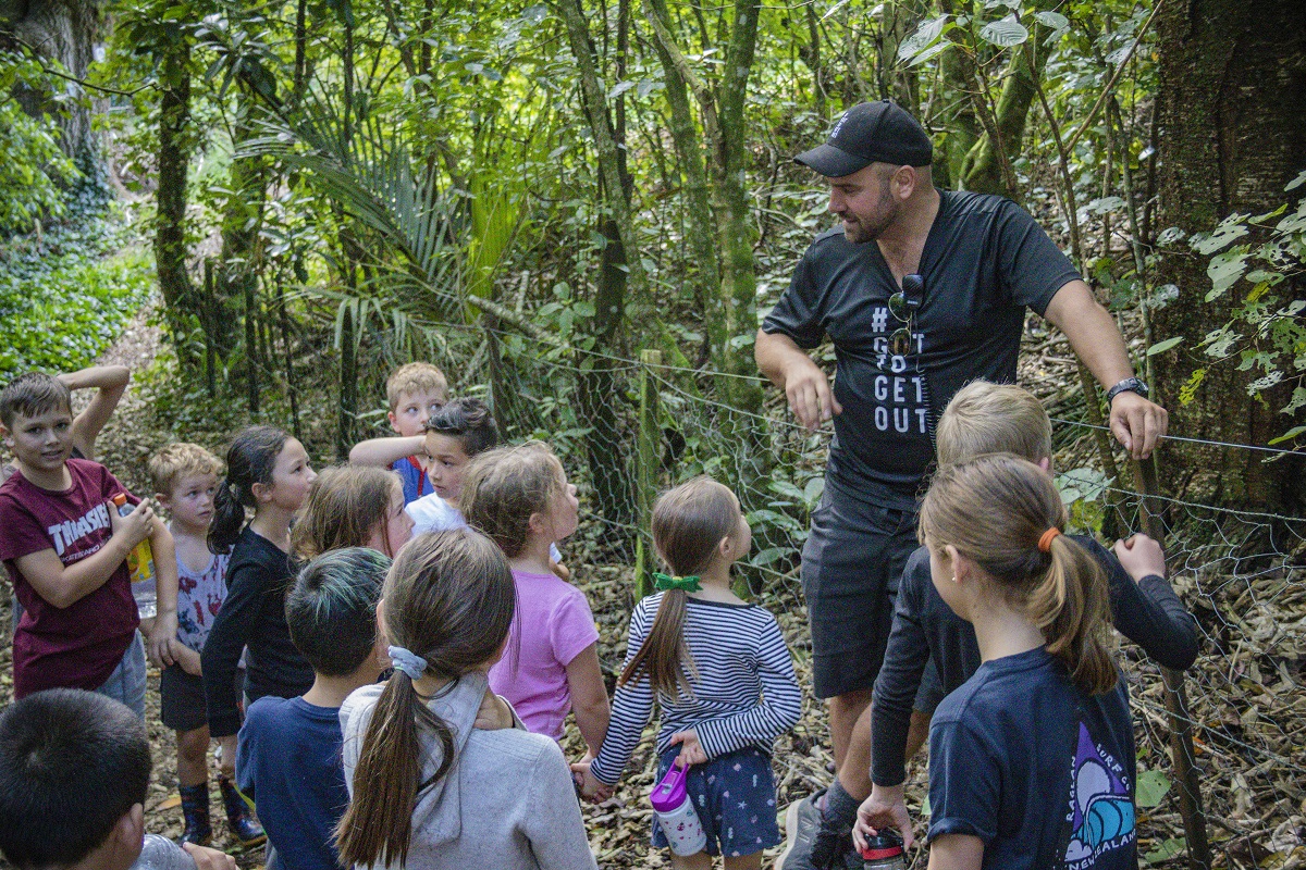 kids on an outdoor trek with a guide