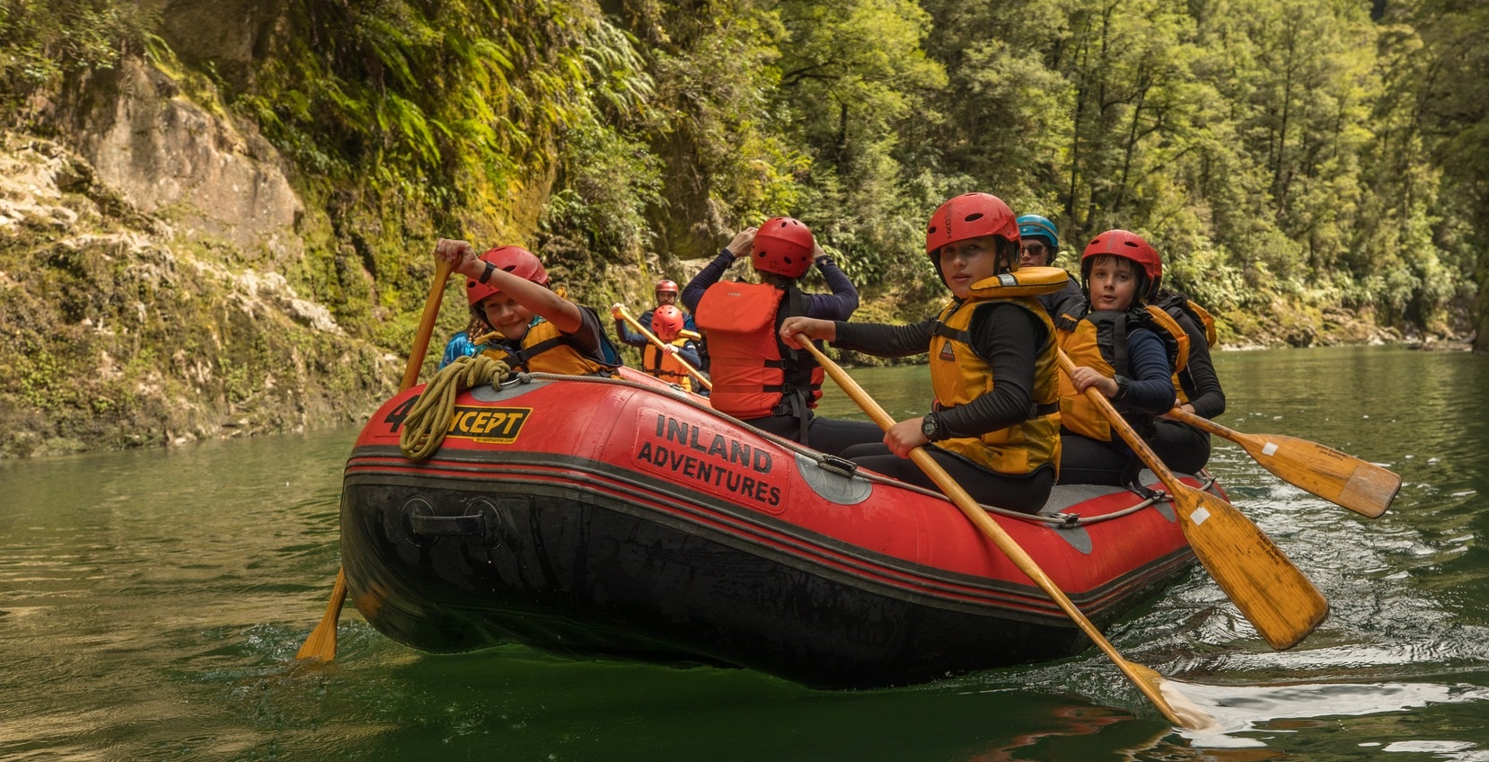 Young women rafting on a river