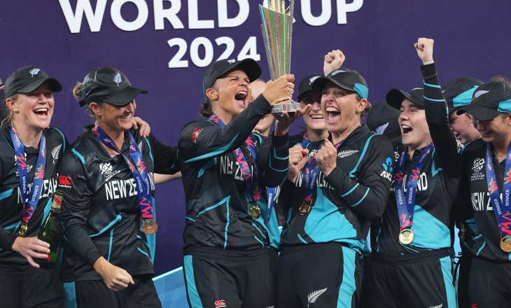 Group of women celebrating with their trophy