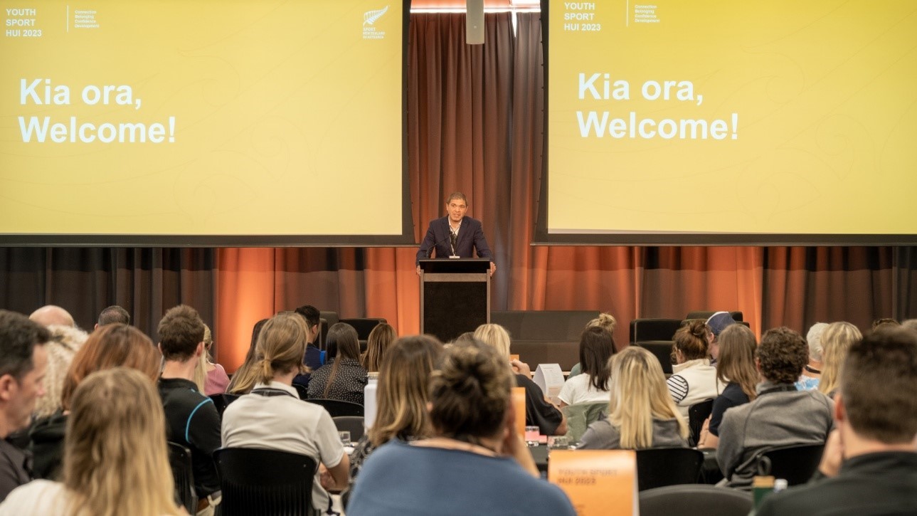 woman standing at a lectern