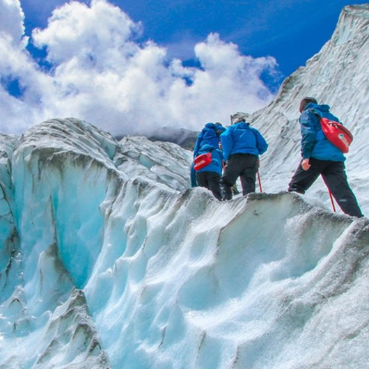 Explorers climbing a mountain of ice and snow