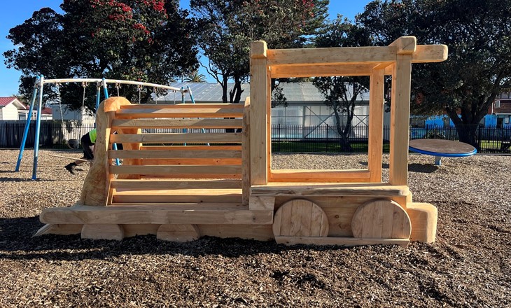 Wooden train in a sandpit