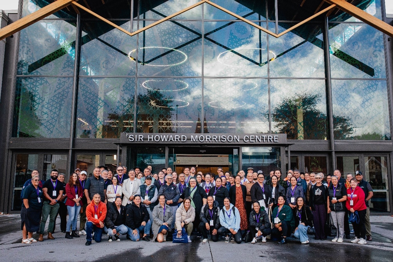 Group of people standing in front of an events centre