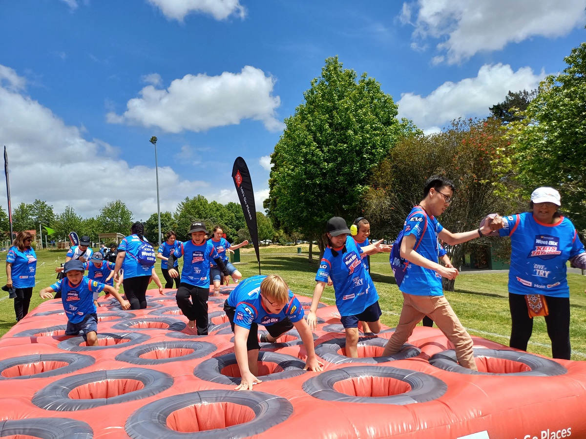 Group playing on inflatable toys