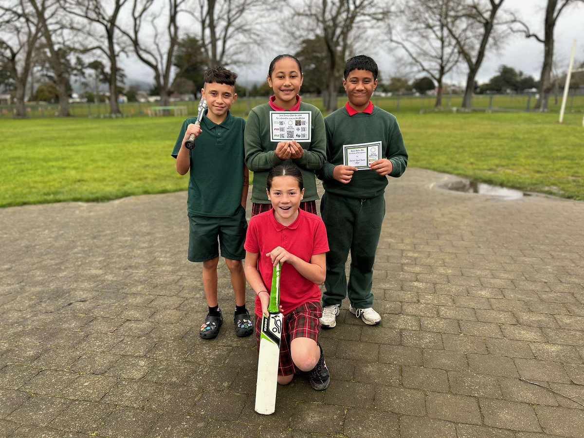 4 tamariki posed with sports equipment