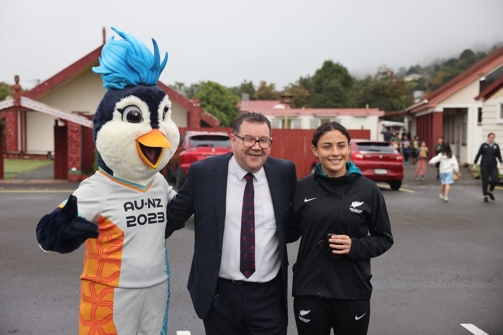 Grant Roberston with a Fifa mascot and Football Fern