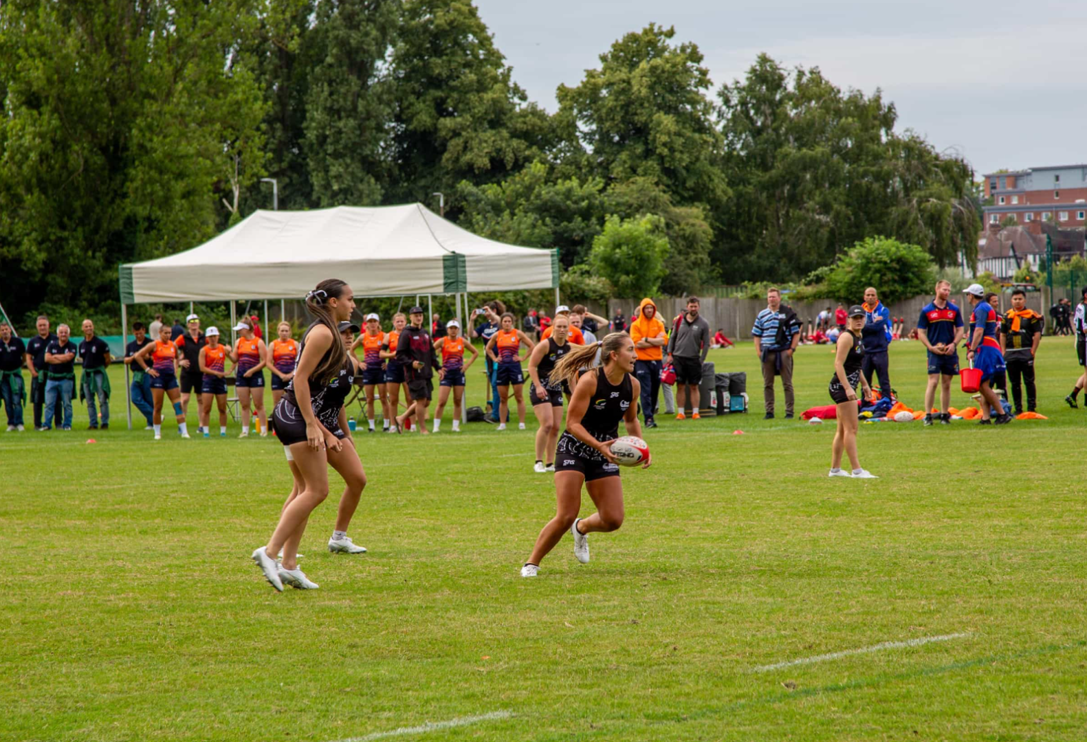 Players playing touch rugby