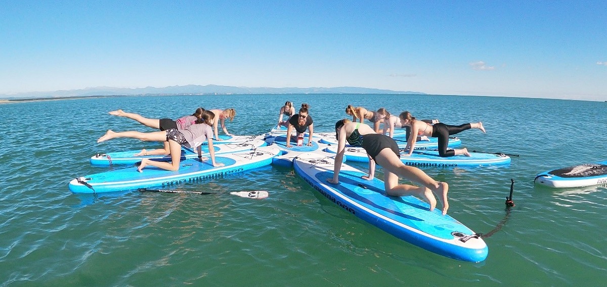 Young women on stand up paddleboards